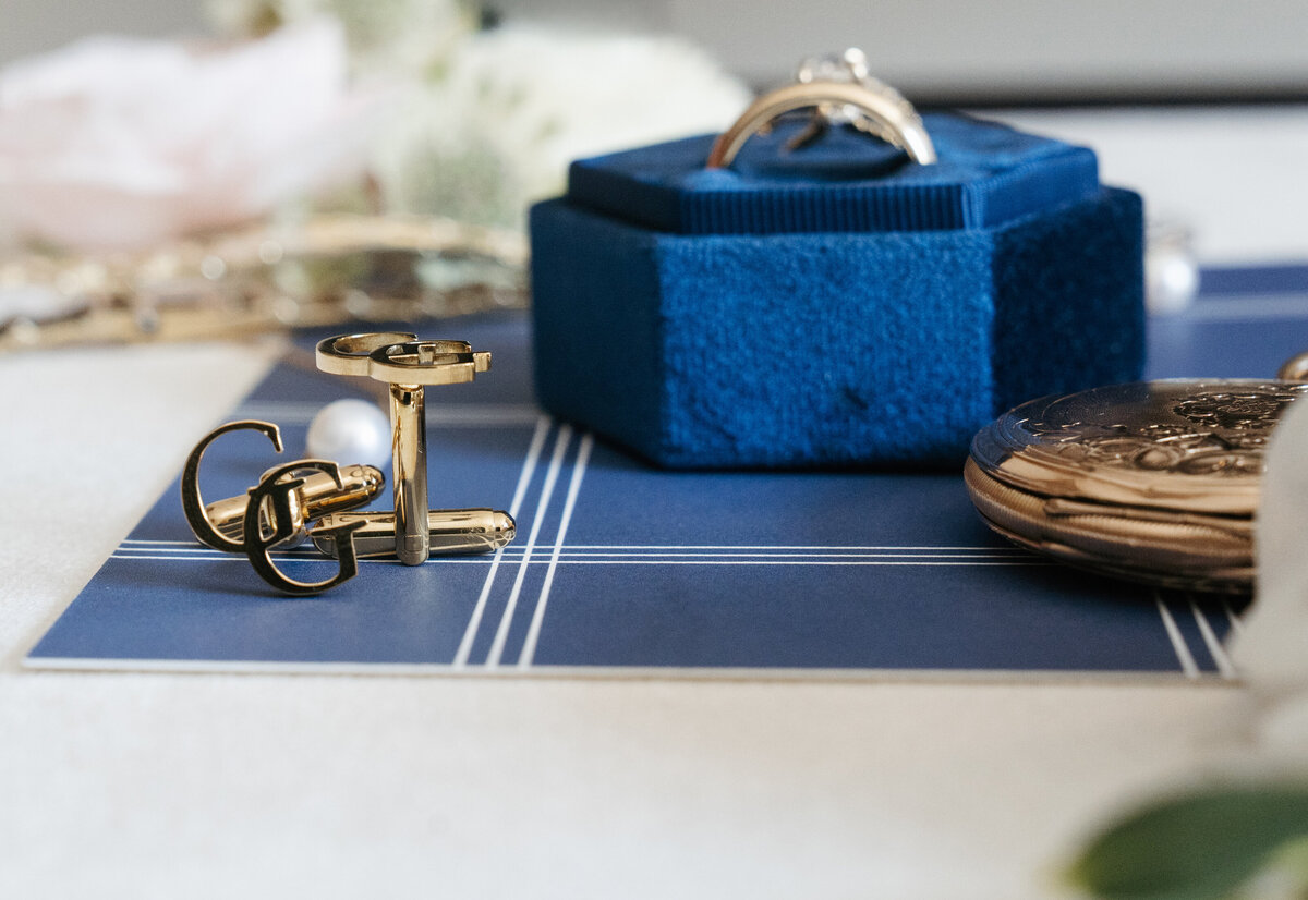 Detail flat lay with wedding rings and stationery at Waverly Oaks