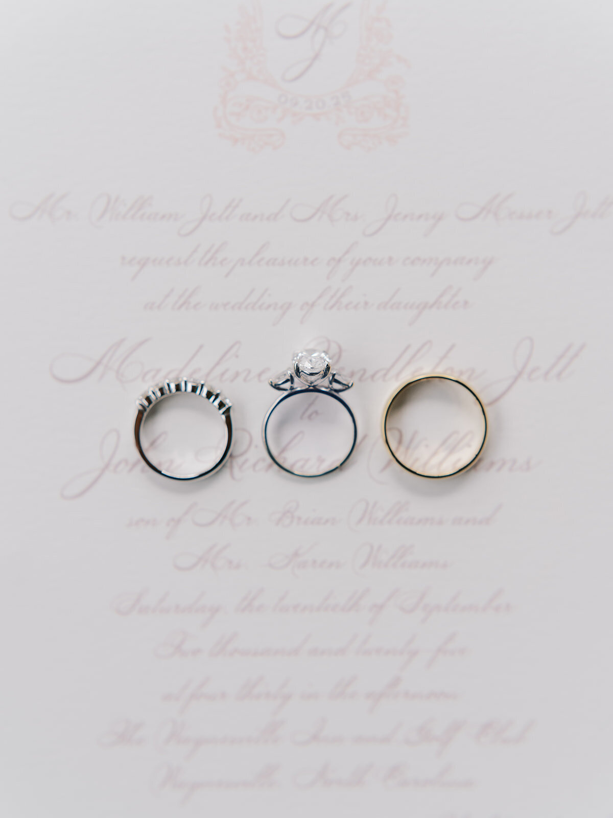 Wedding invitation with three rings styled on top, photographed at The Waynesville Inn & Golf Club in Waynesville, North Carolina.
