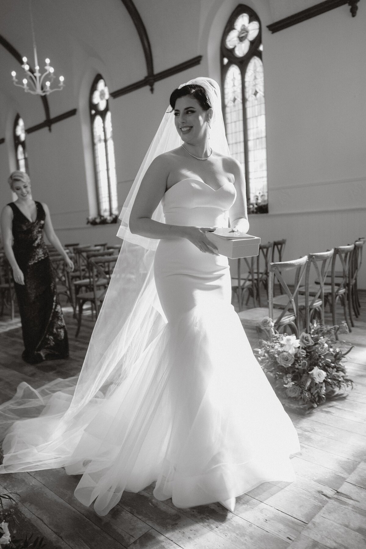 sun filled church lights up the bride walking through the ceremony space