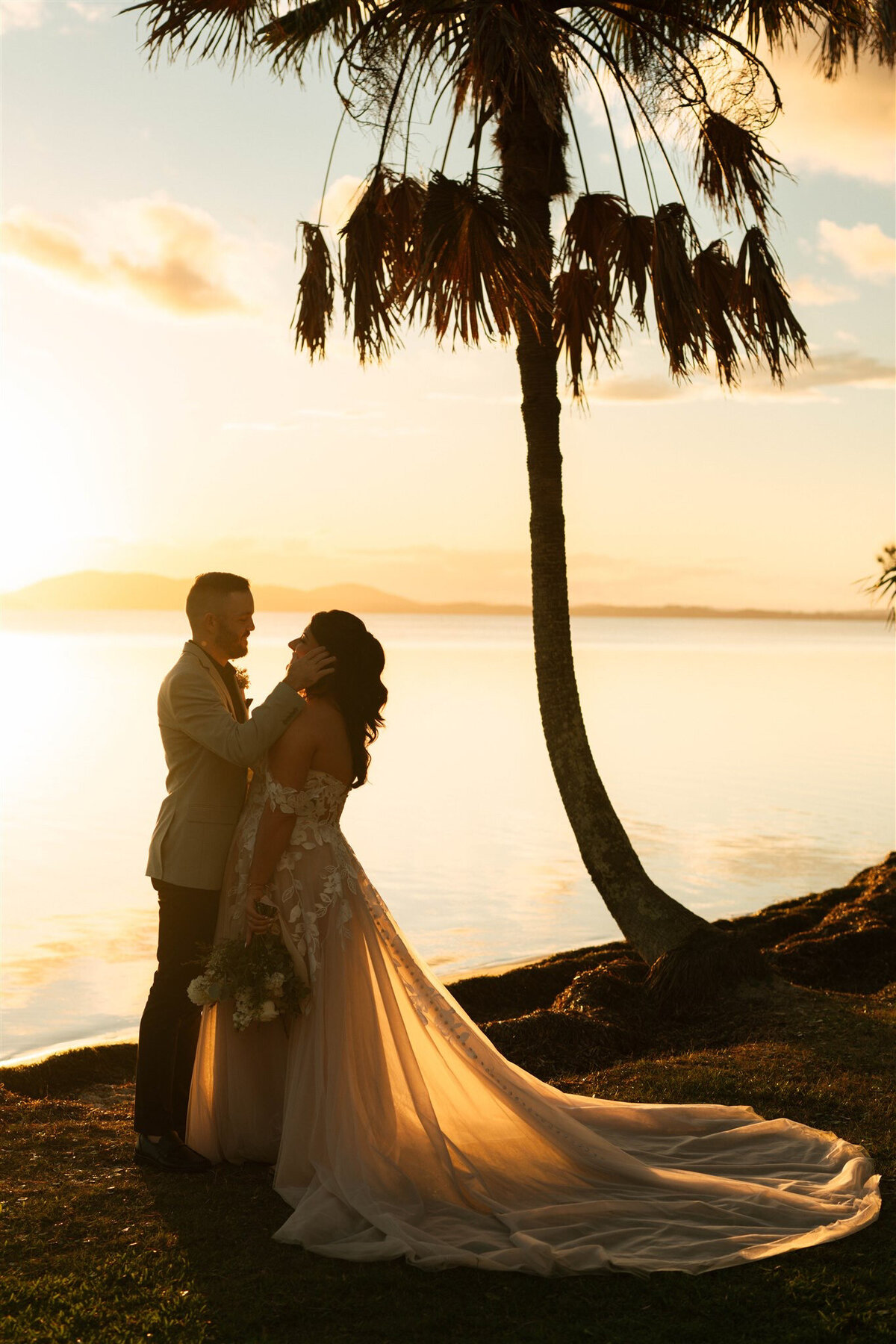 palm pavilion golden hour couple looking at each other