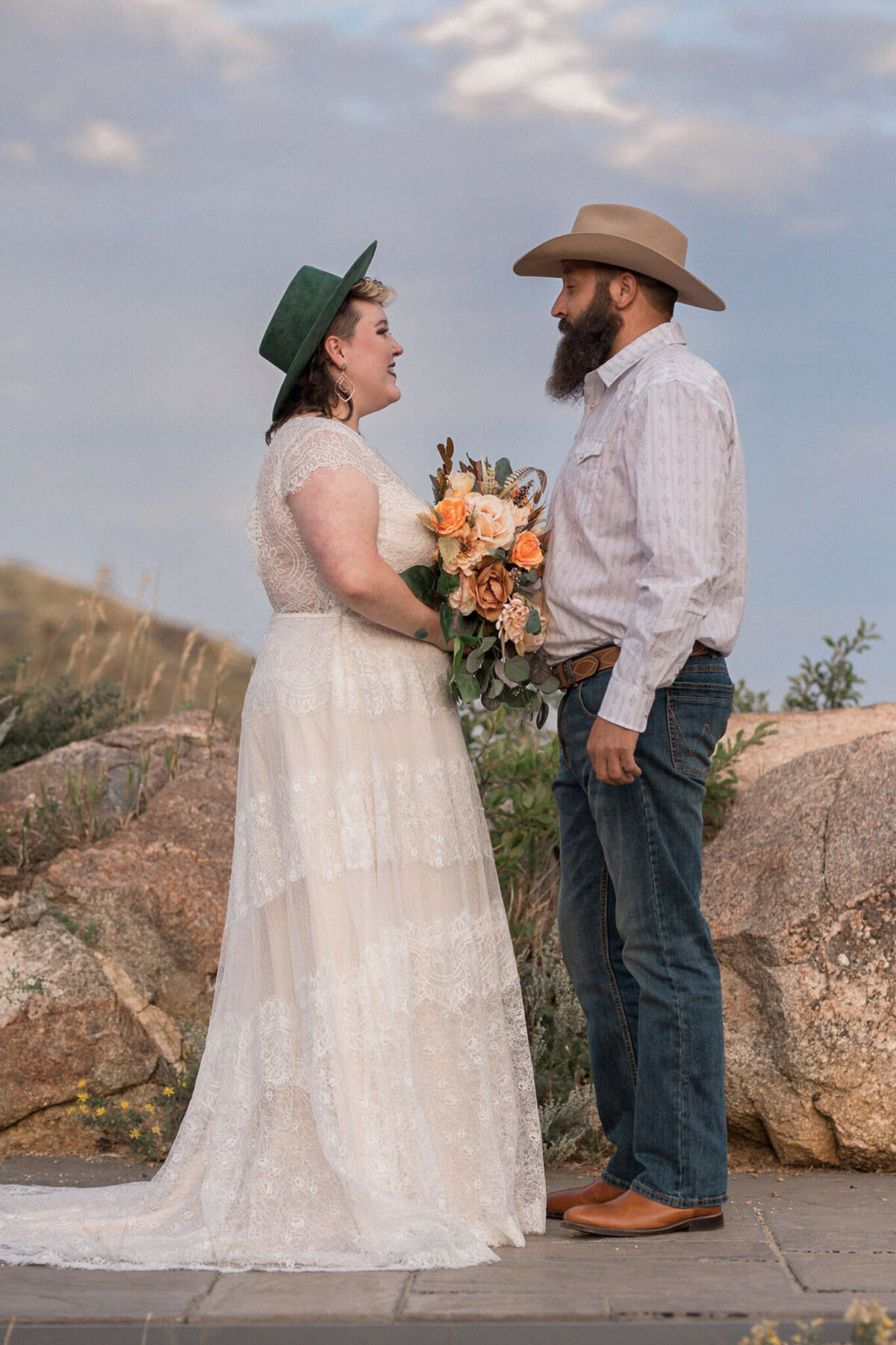 The bride and groom admire each other for the first time in their wedding attire.