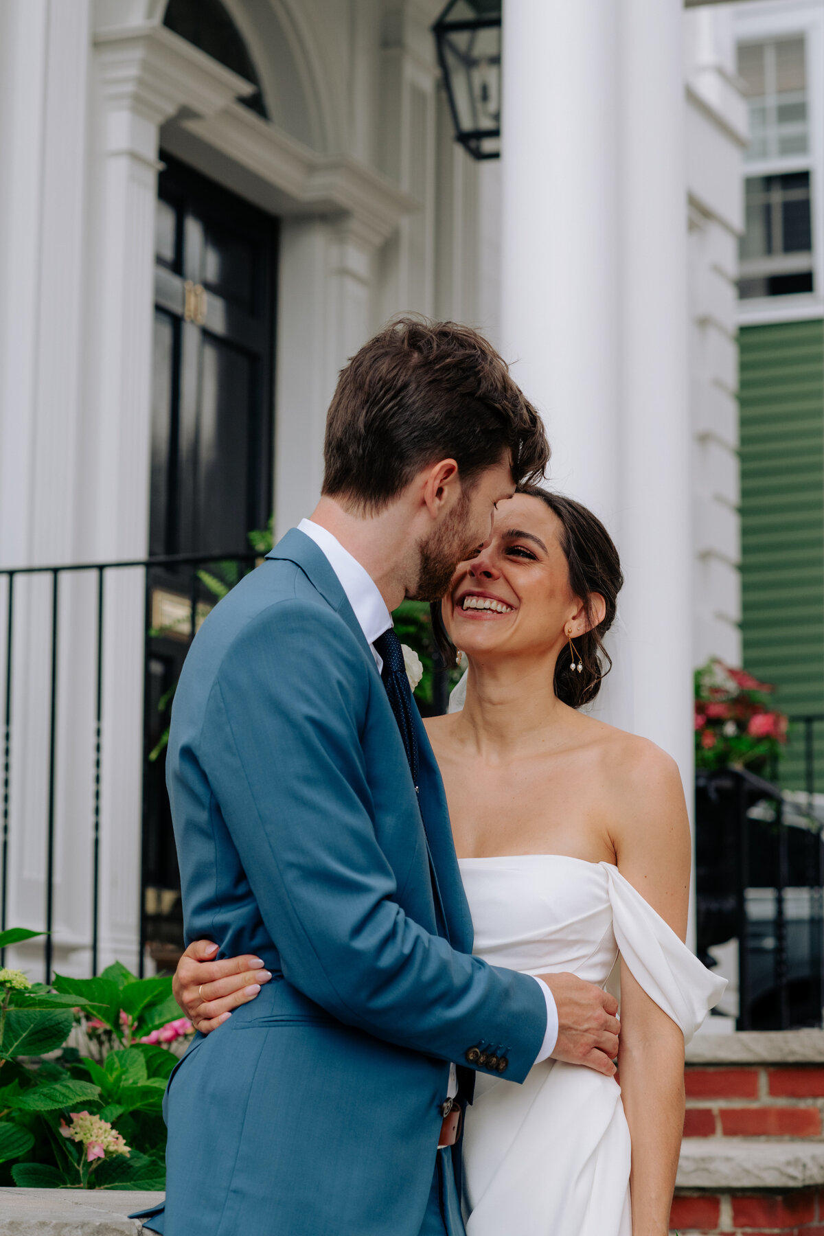 Bride and groom kissing at downtown Newport wedding