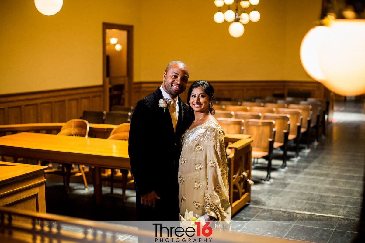 Bride and Groom pose inside the courtroom