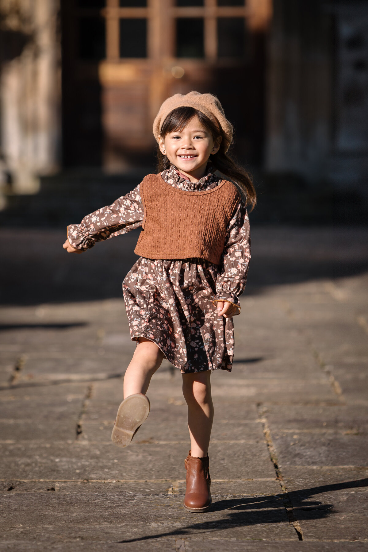 Little girl dressed in autumn colours at Hinwick Hall Bedfordshire