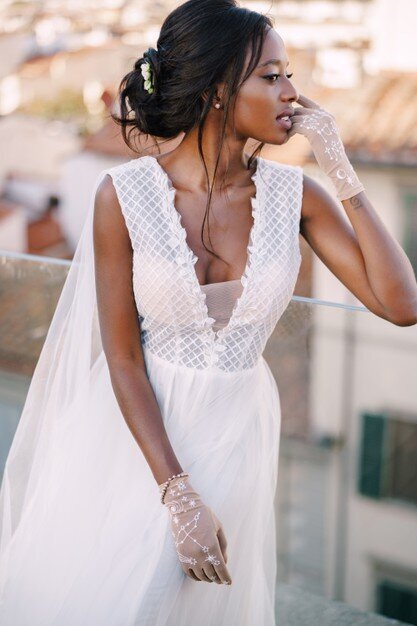 beautiful-african-american-bride-white-wedding-dress-touches-her-face-vintage-gloves_278455-91