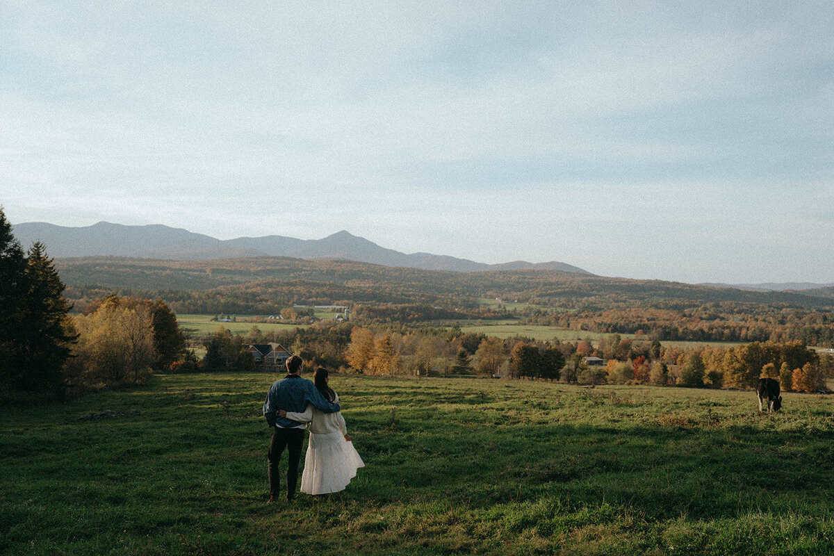 couple in field during vermont engagement photos, captured by Elsie Goodman, an NYC and destination engagement photographer
