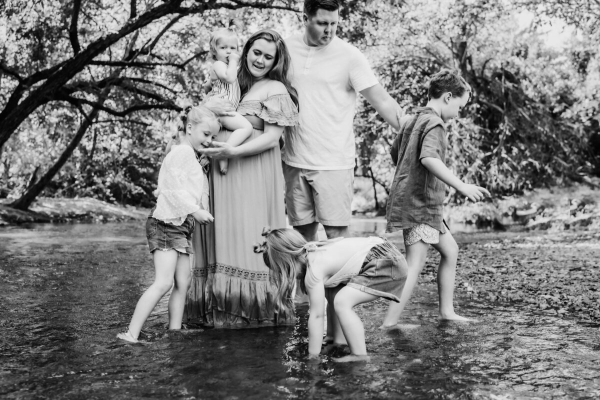 family-playing-in-creek