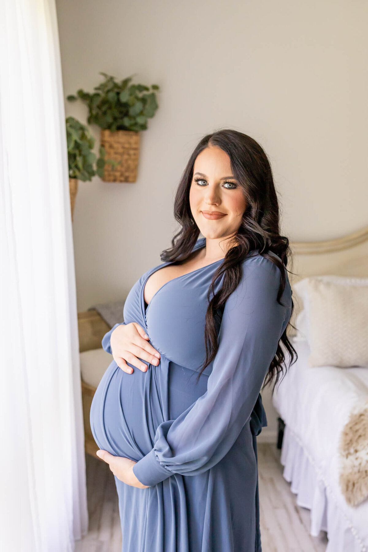 Expectant mom in a blue maternity dress