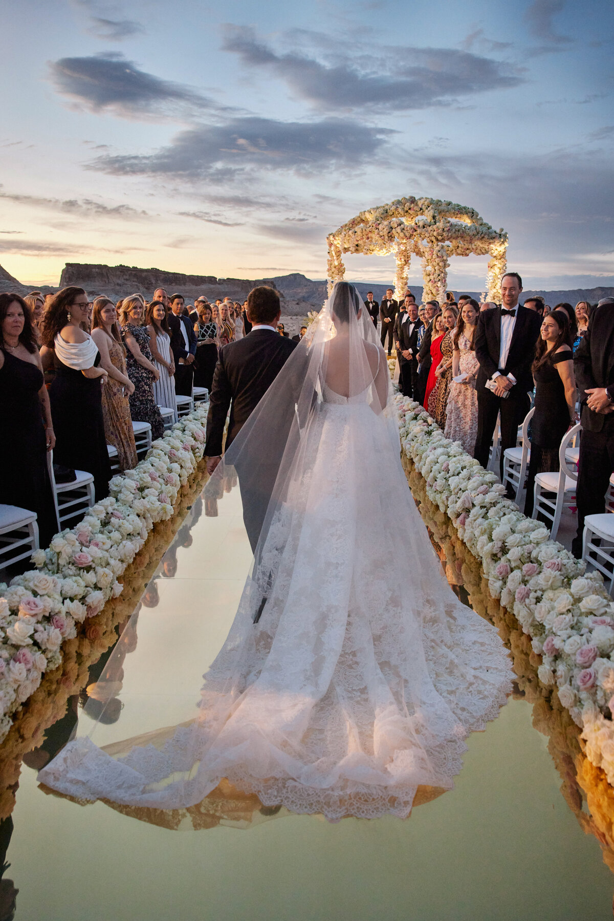 Bride walking down golden aisle at Amangiri Utah
