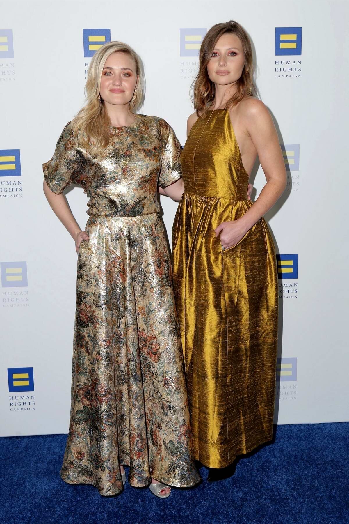 Aly and Aj Michalka posing together at the Human Rights Campaign event in full length dresses