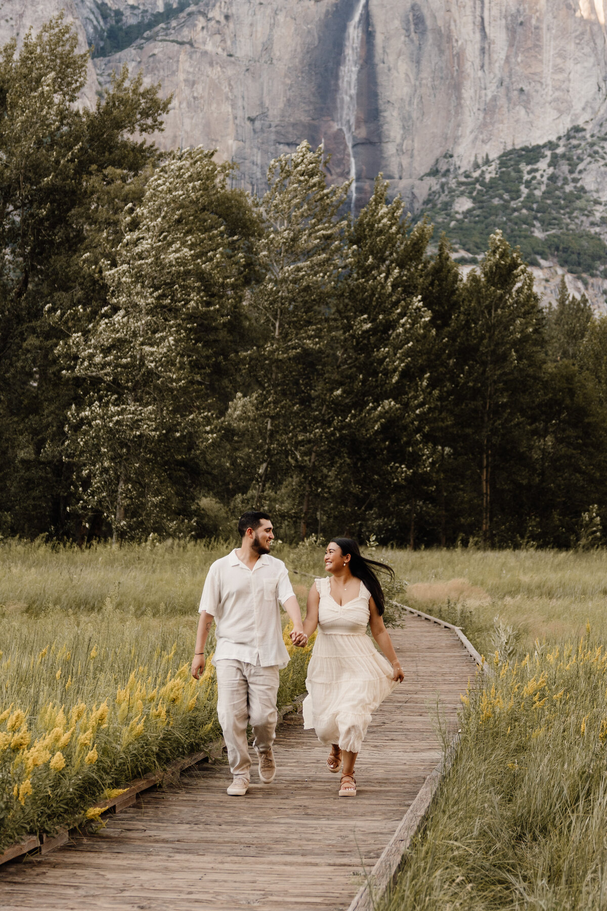 couple runs in yosemite valley national park