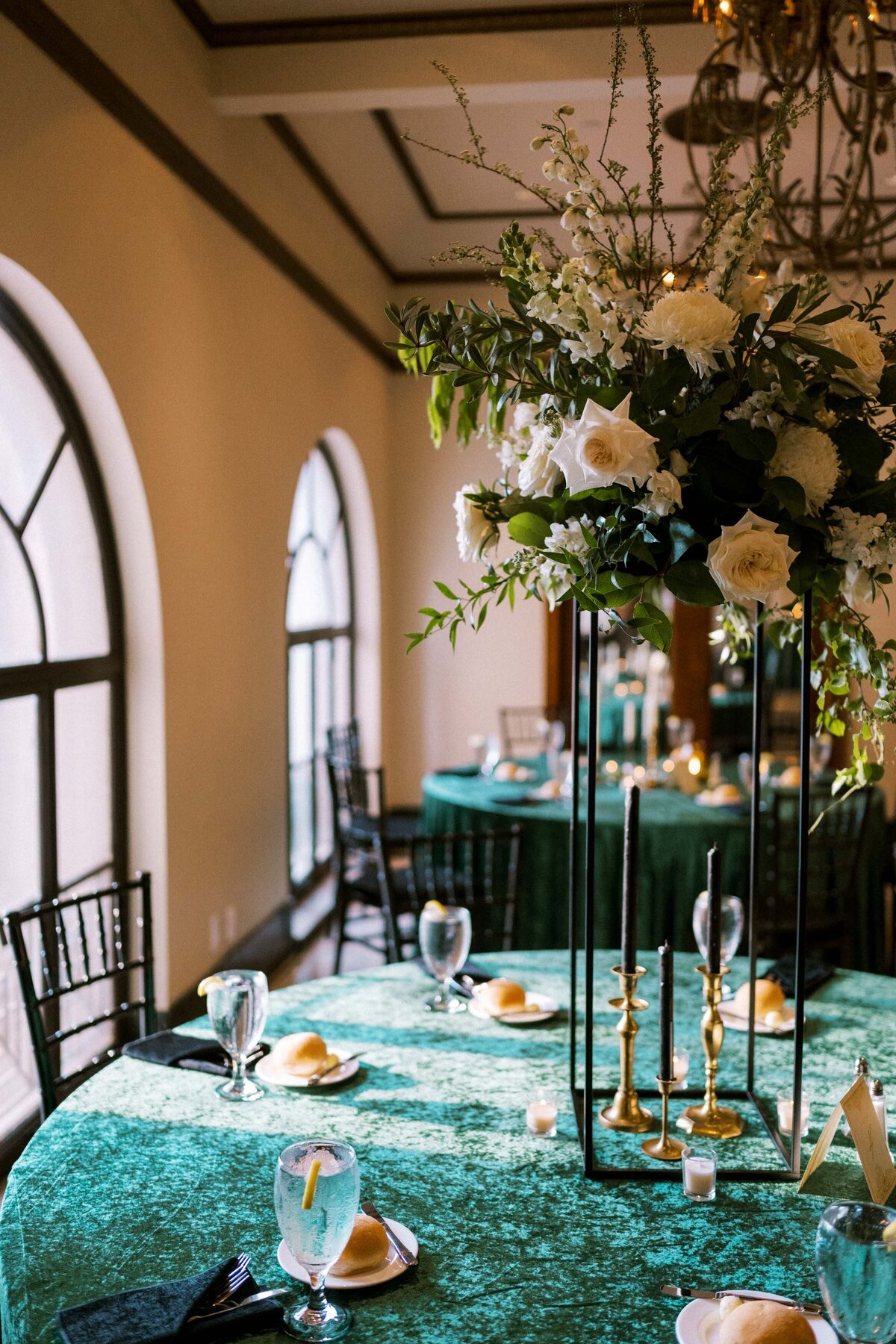 wedding-reception-tall-centerpieces-green-linens