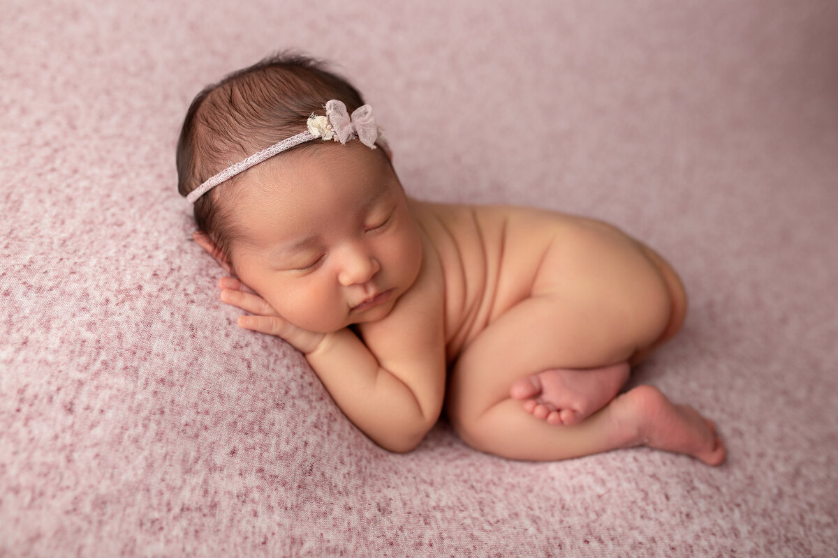 San Fernando Valley Newborn baby girl sleeping on pink backdrop