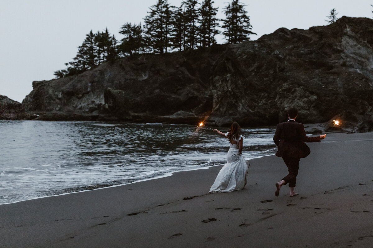 bride and groom walking on beach