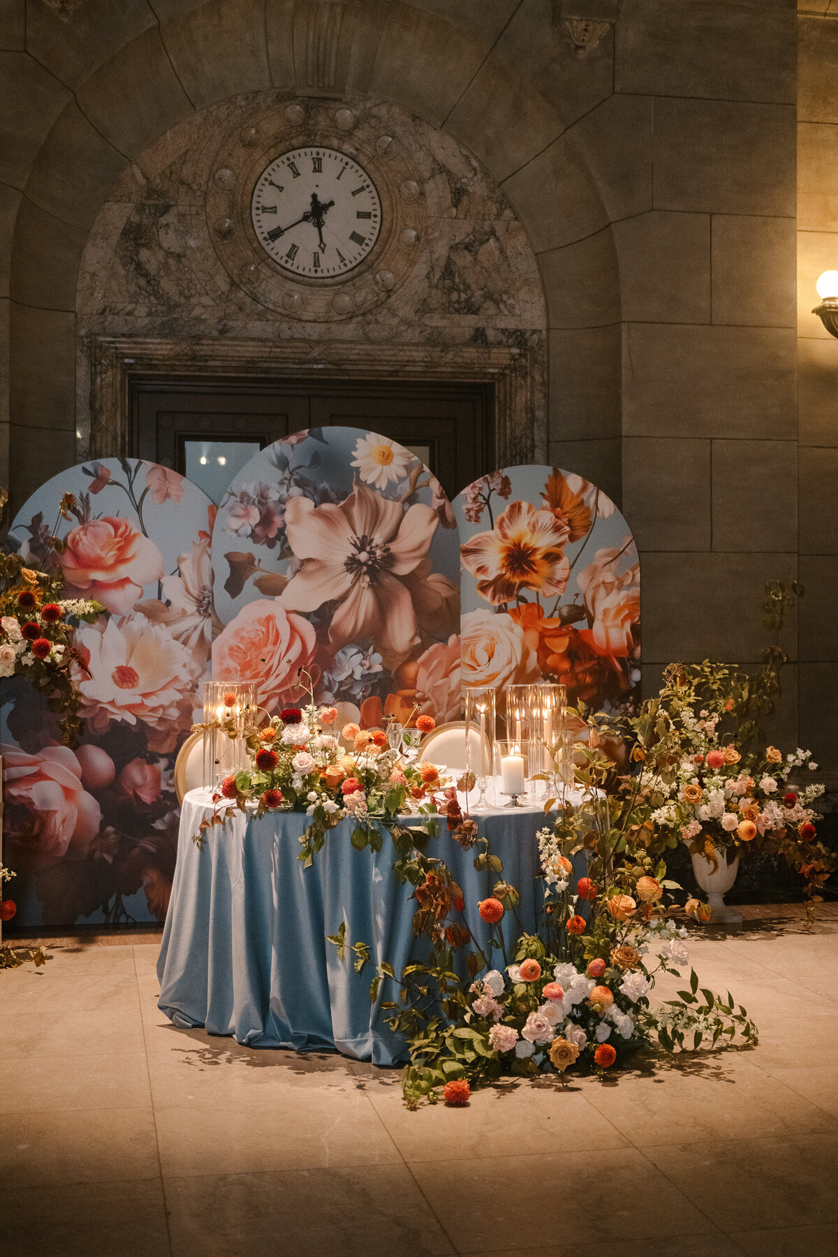 A table at Theatre St James is decorated with a meadow of colourful wedding flower arrangements.