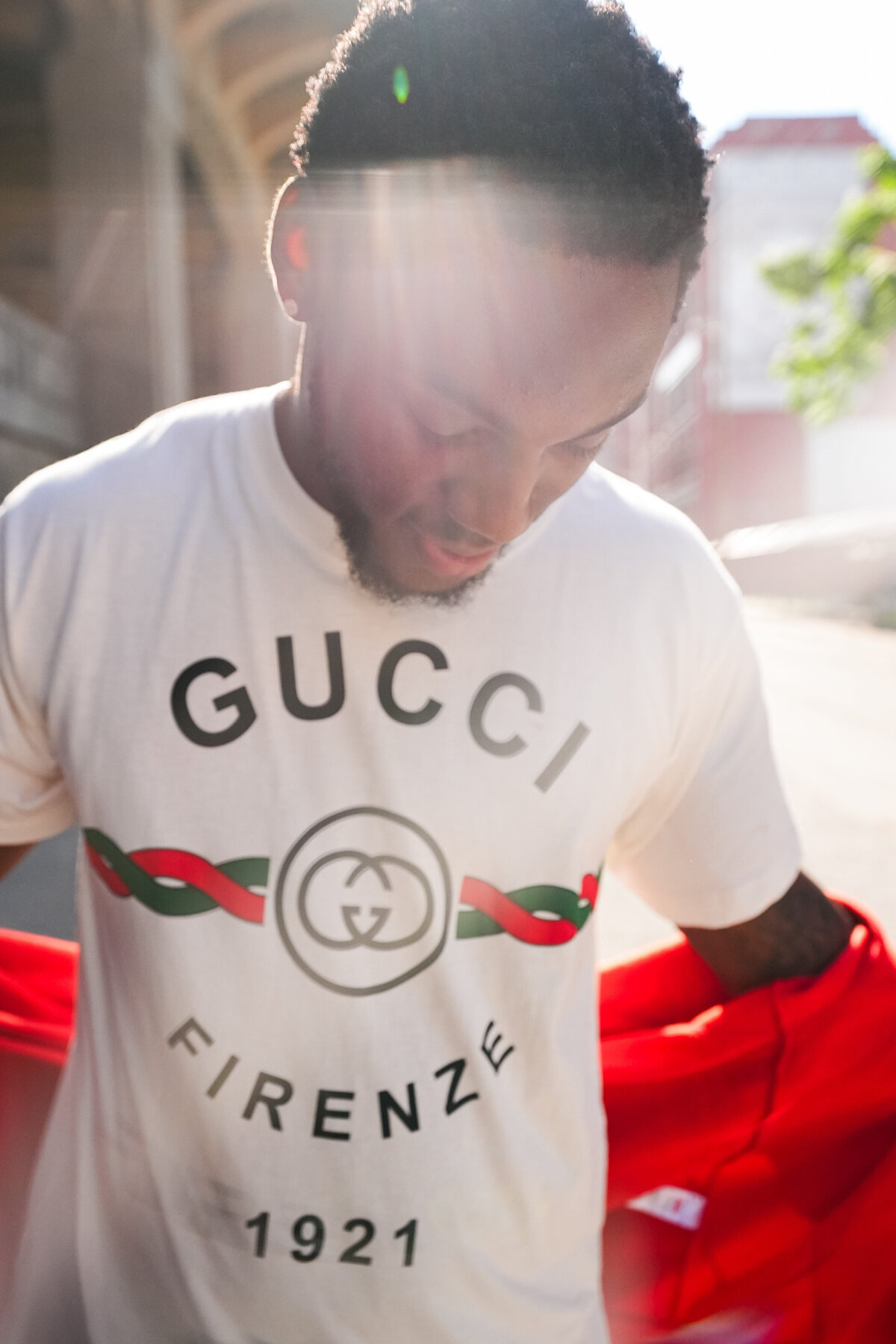 kansas-city-marketing-photography-people-0117-man-in-red-and-white-gucci-sweater-looking-down