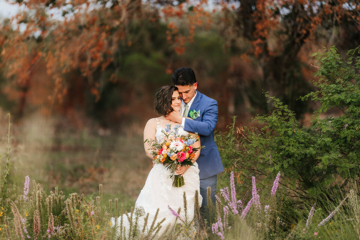 couple-poses-in-fall-trees