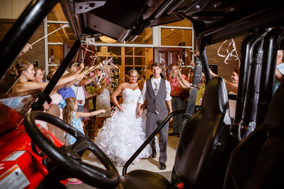 The newlyweds exit the wedding reception in a off road vehicle at the Citronelle Community Center in Citronnele, Alabama.