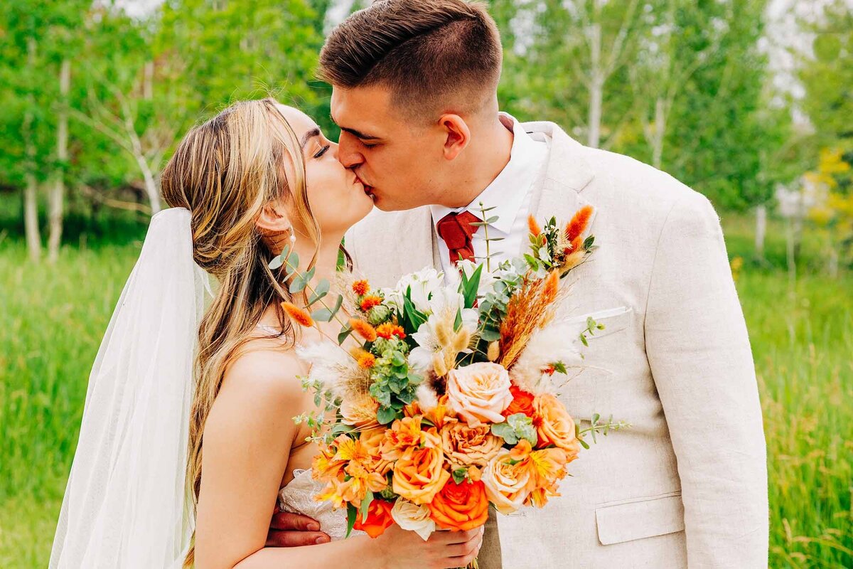 Wedding photo bride and groom kissing at Shades of Green Events, Helena