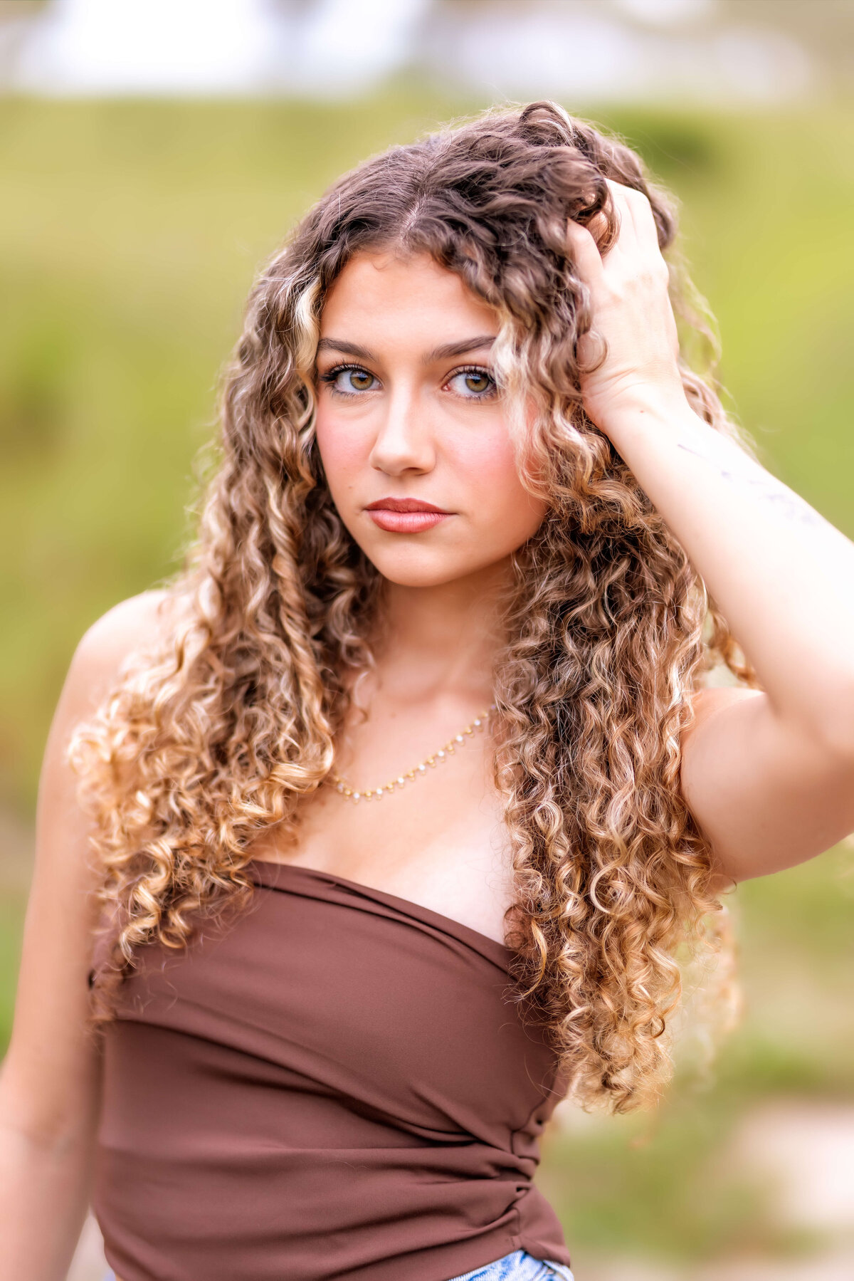 Soft, dreamy close-up portrait of a teen girl during her Orlando senior photography session.