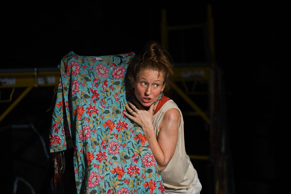 A person leaning up against a board while in a play