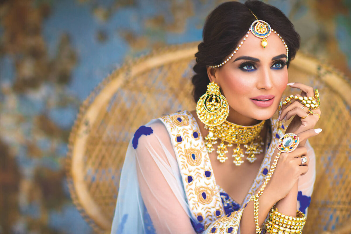 Beautiful bride wearing large gold jewellery