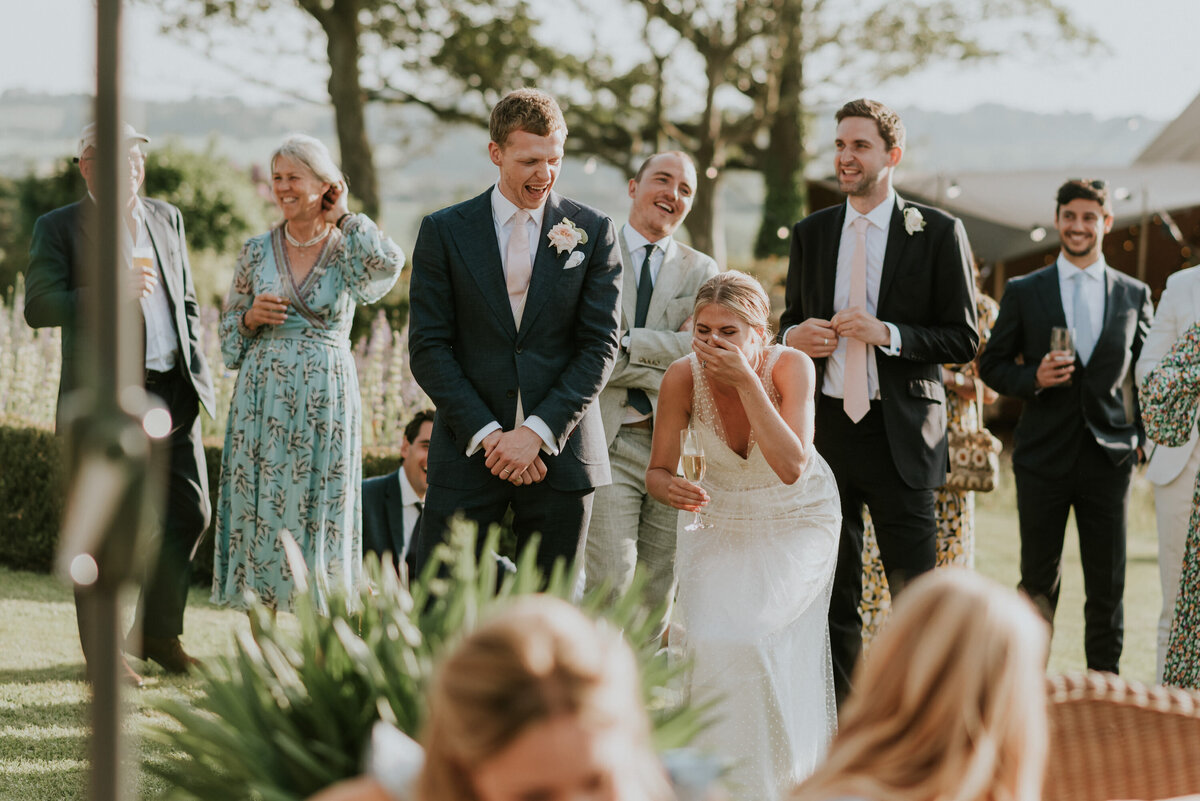 Bride laughing during speeches