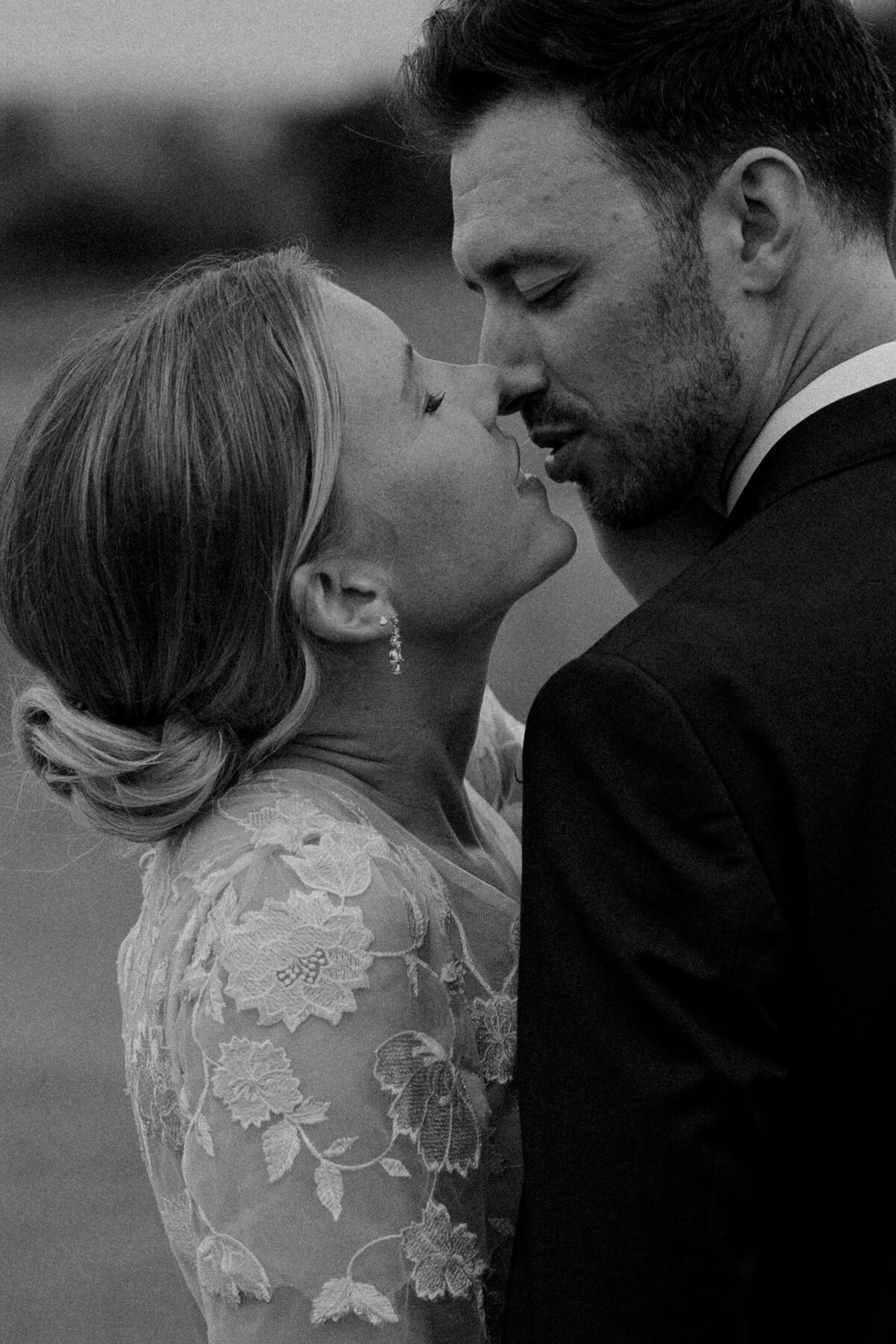intimate bride and groom kiss