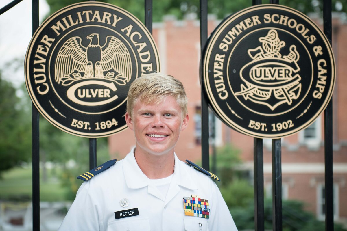 A Culver Summer Naval student stands at Logansport Gate for his formal portrait at Culver Academies.