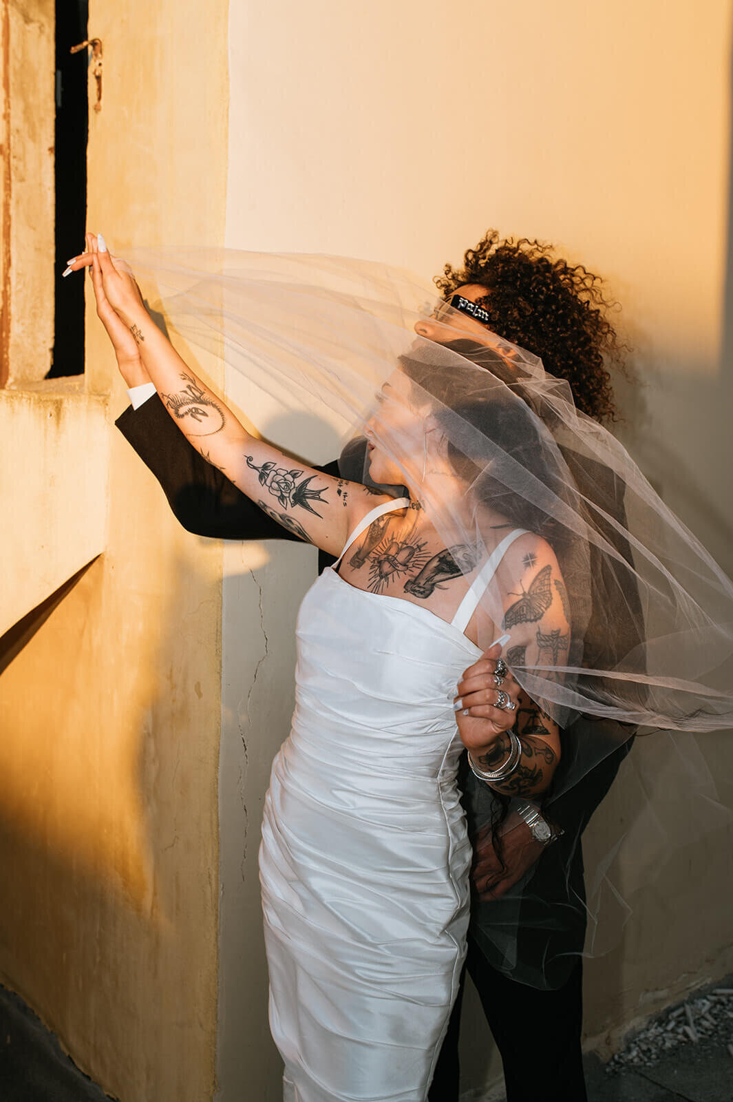 Bride-veil-over-face-with-groom