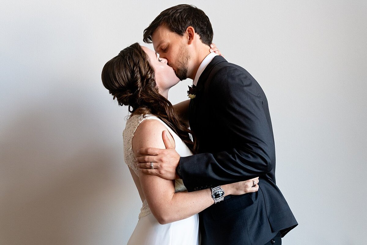 Bride and Groom share a first kiss at self-uniting Quaker wedding ceremony in Pittsburgh, PA