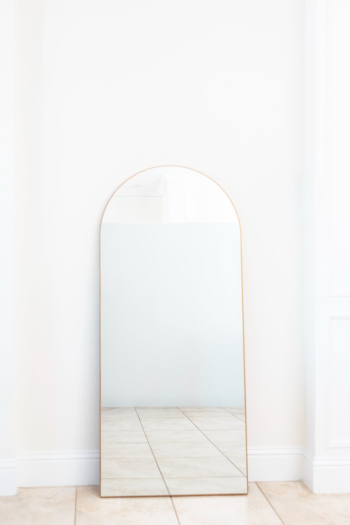 Large gold arch mirror with stand