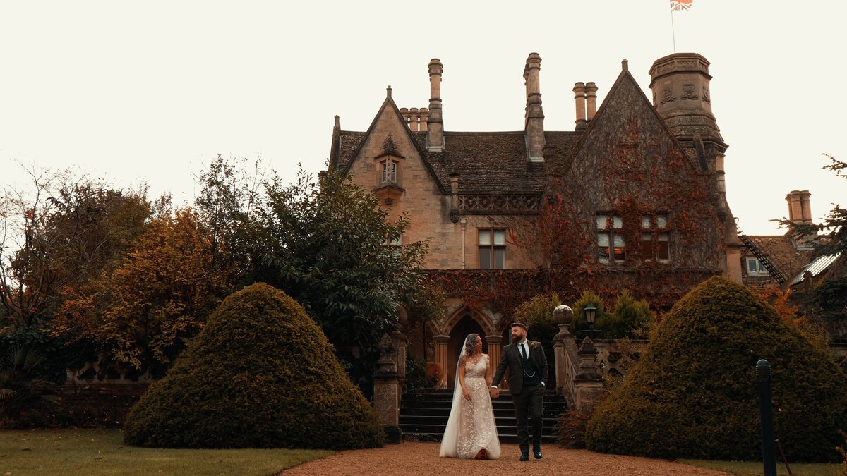 The Bride and Groom from their wedding highlights film at Manor by the Lake, captured by Cotswolds Wedding Videographer HC Visuals.