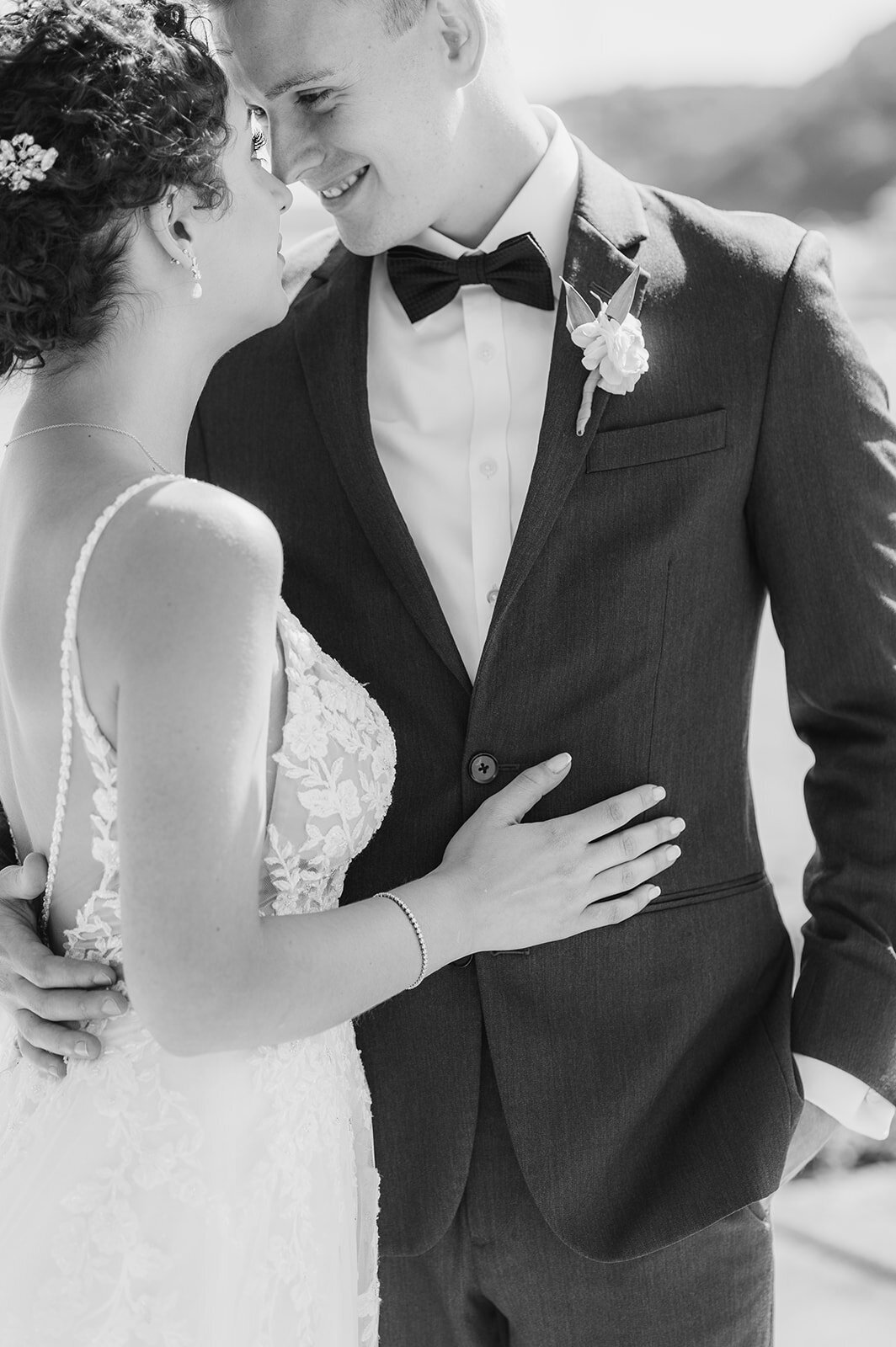 bride and groom snuggle on their wedding day in poughkeepsie, ny