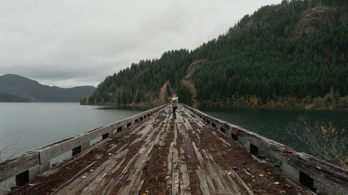 Couple on a trestle bridge in Campbell River during their engagement session by latitude 49 photography