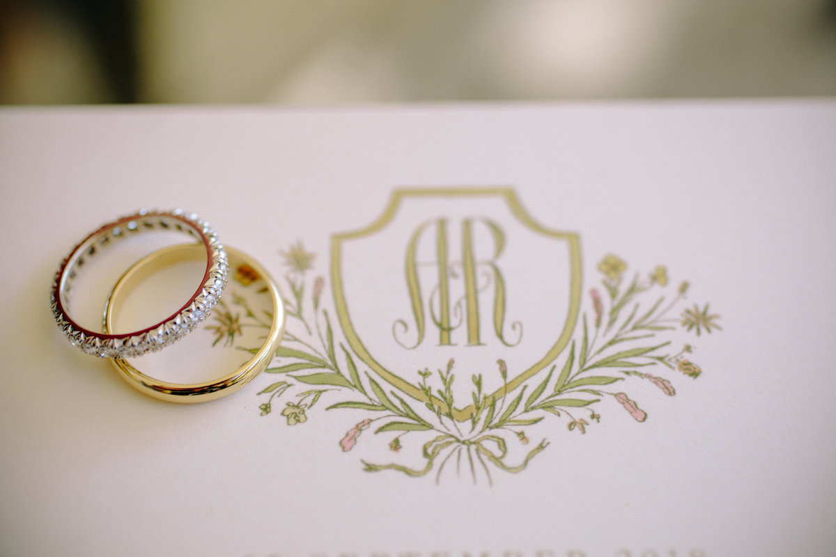 Wedding rings and invitation at a wedding at Beltane Ranch, Sonoma.