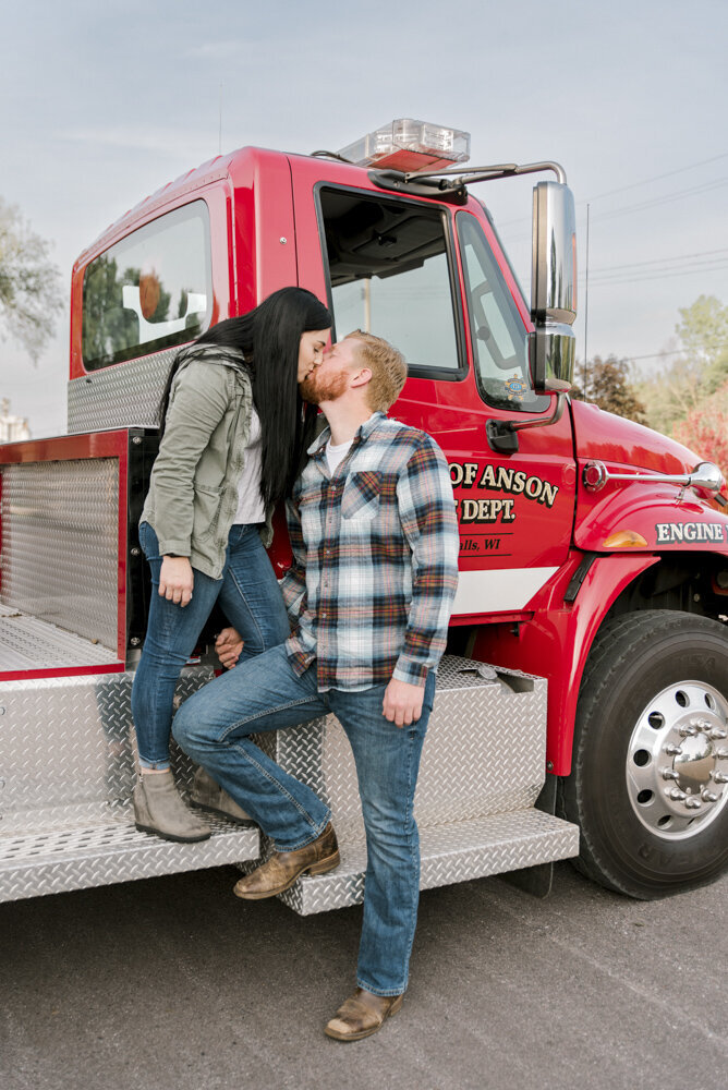 firefighter engagement photo with firetruck