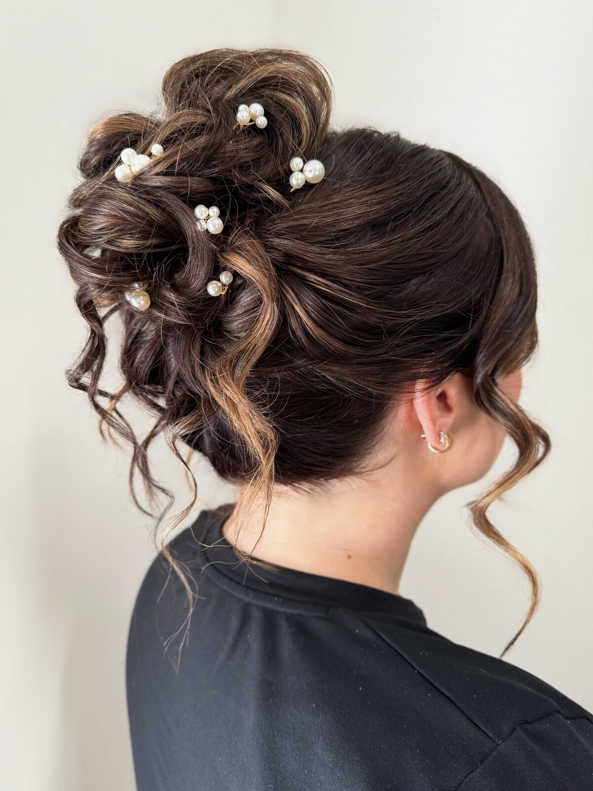 high messy bun updo bridal hairstyle with pearl hair pins