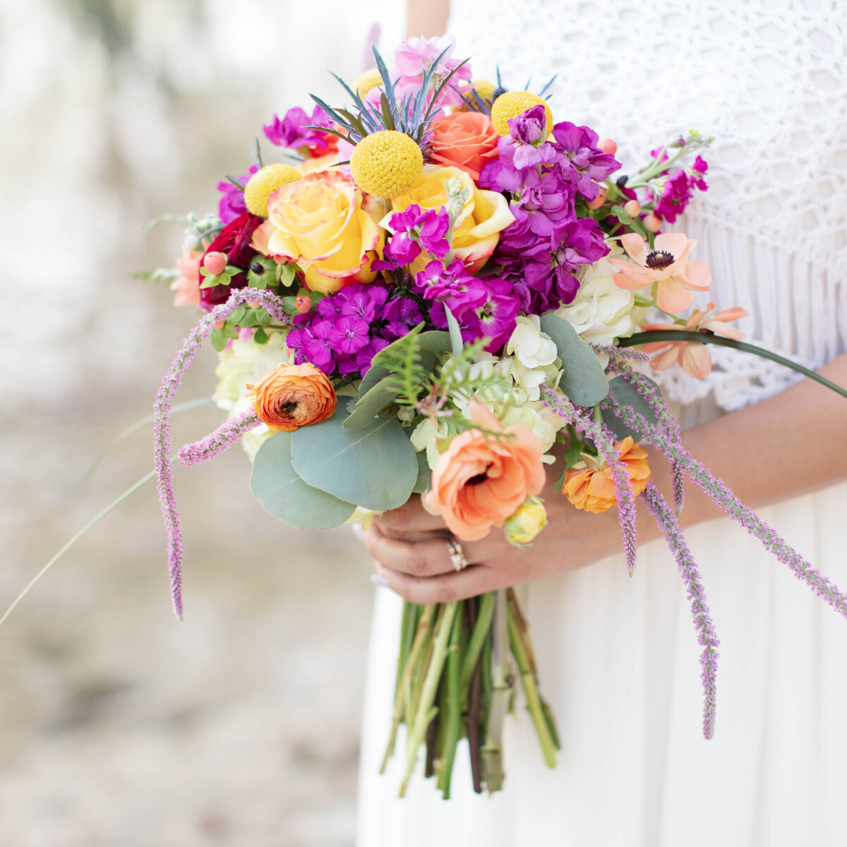 summer bouquet of purple peach and yellow at boho wedding in New Braunfels Texas on the river by Firefly Photography