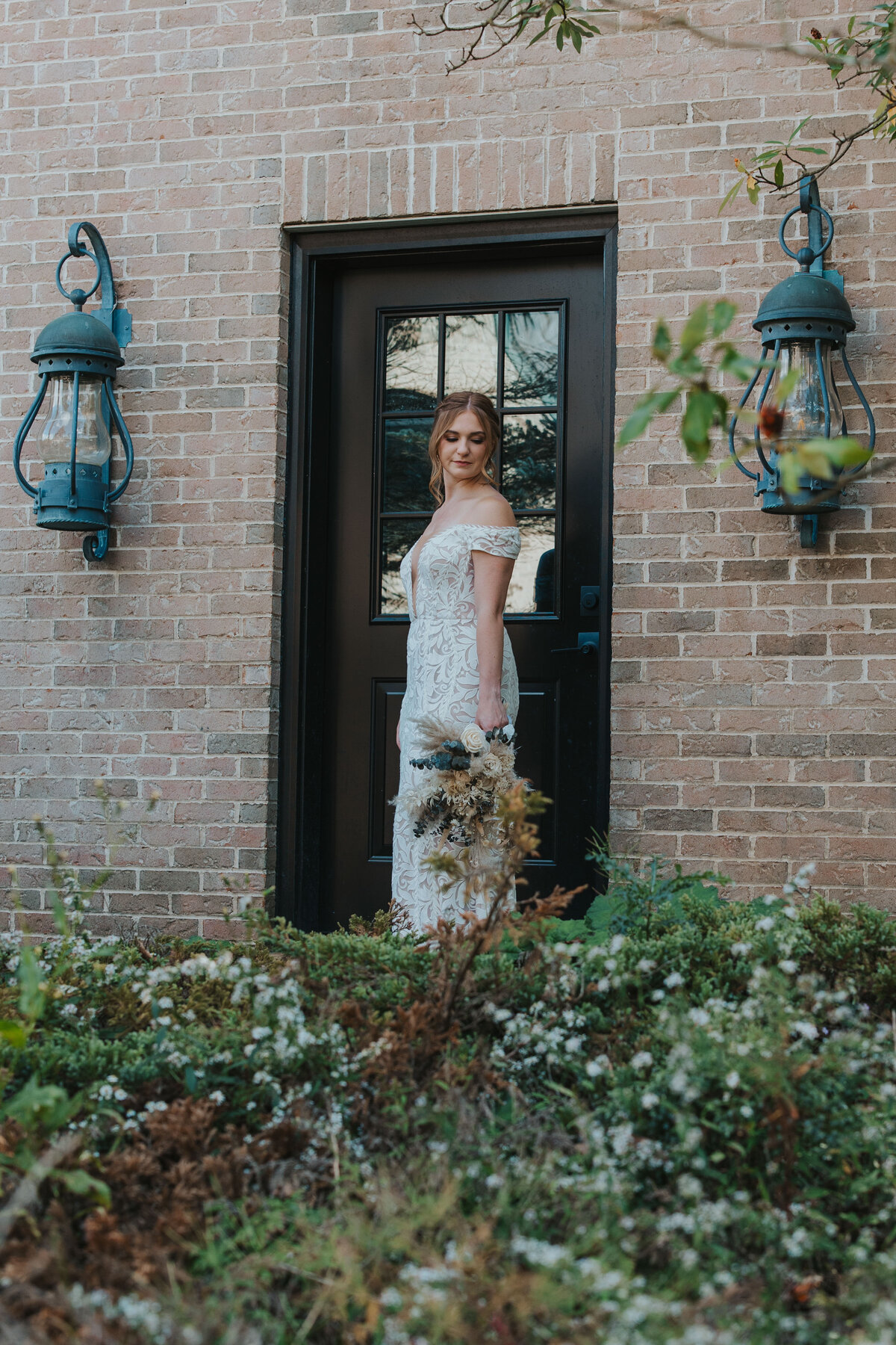 bride standing in the door way waiting for her wedding to start