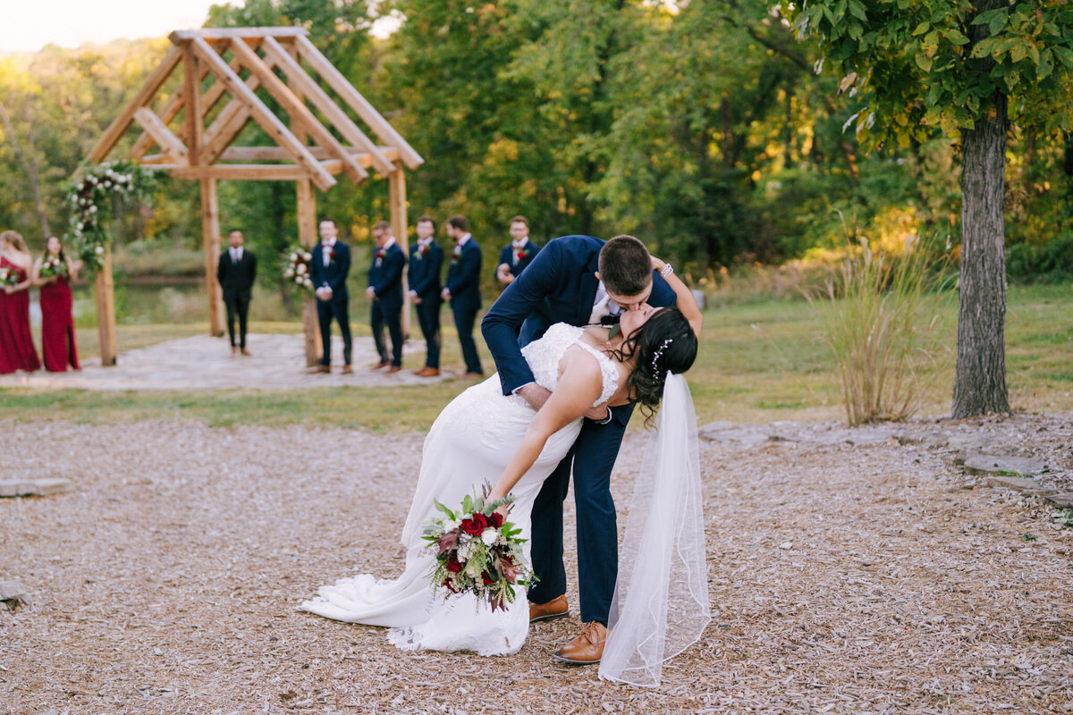 A tattooed couple laughing during their Springfield, MO elopement, captured by Chelsea Stanford.