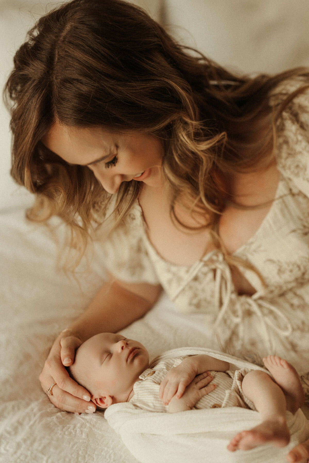 Newborn baby swaddled in light wrap during Franklin Tennessee lifestyle session