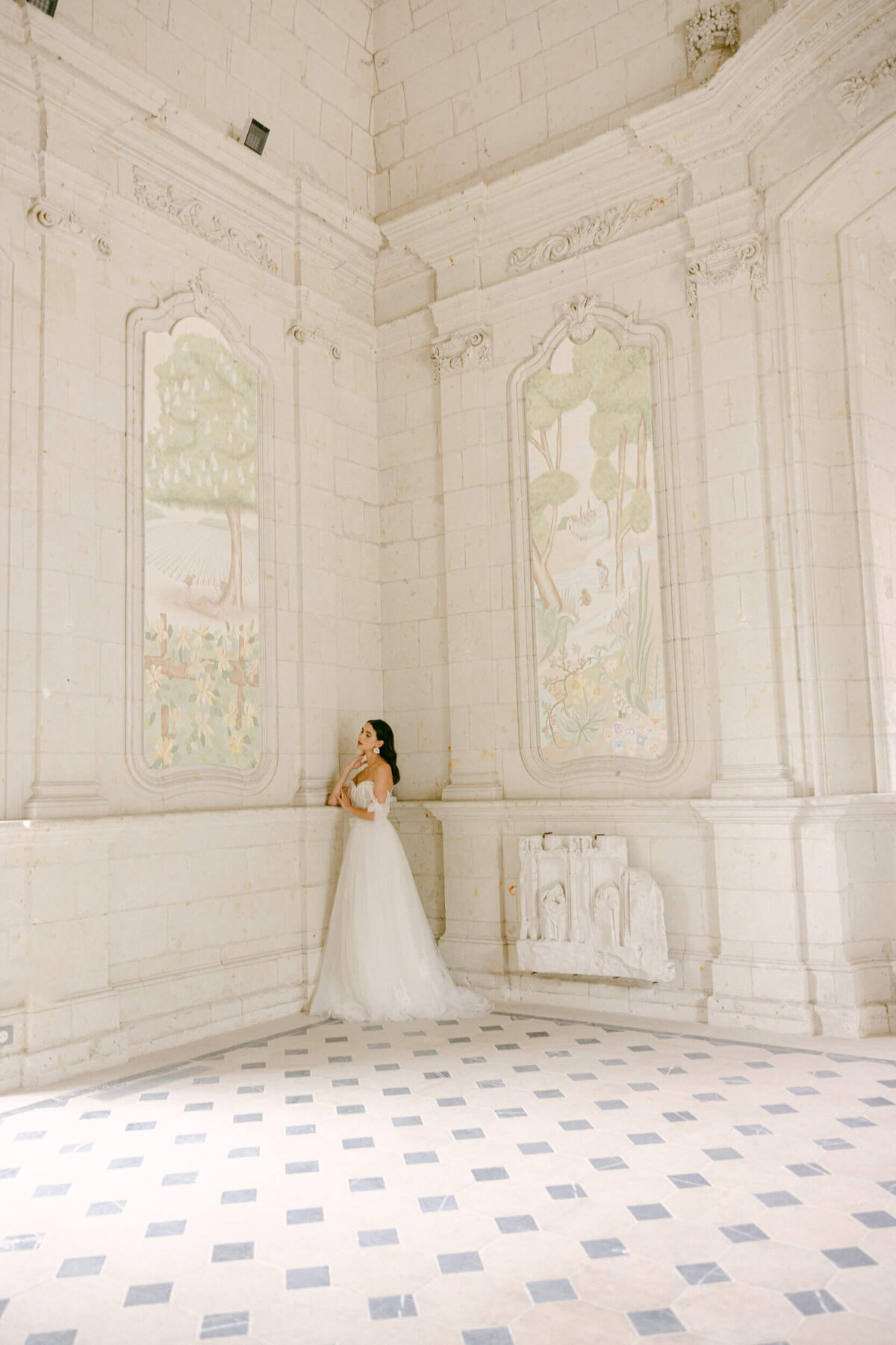 A wedding day photo of a bride in her white wedding dress at Chateau de Jalesnes in France