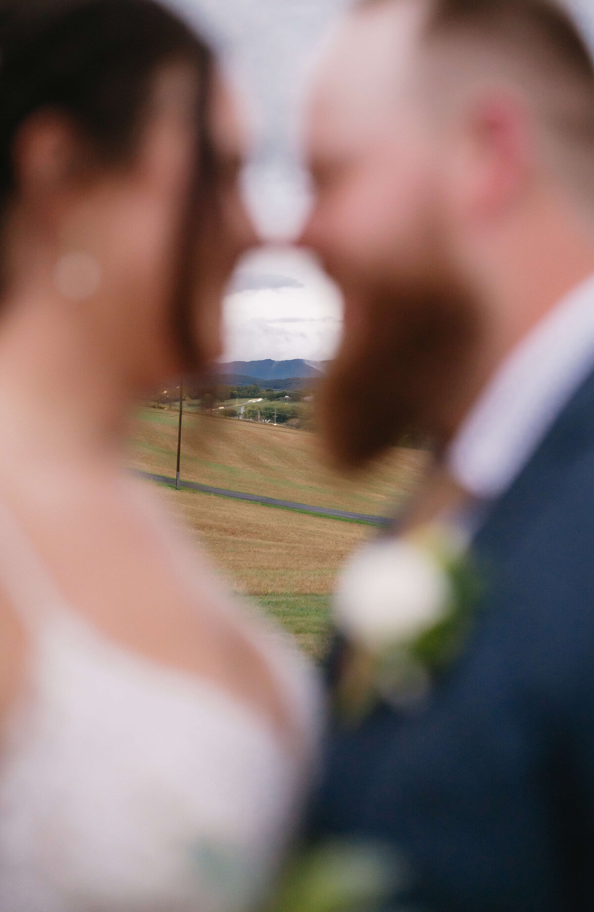Sunny Slope Farm venue with Shenandoah National Park wedding couple leaning into each other