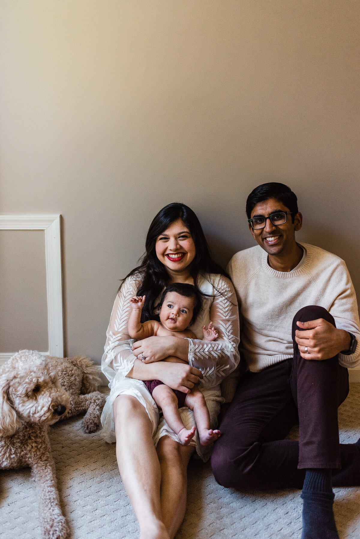 newborn photos of family with baby girl and dog in their home in Reston VA