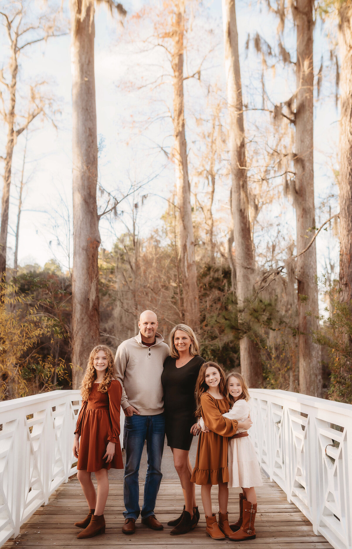Family poses for portraits during  Family Photos at Cypress Gardens near Charleston, South Carolina.