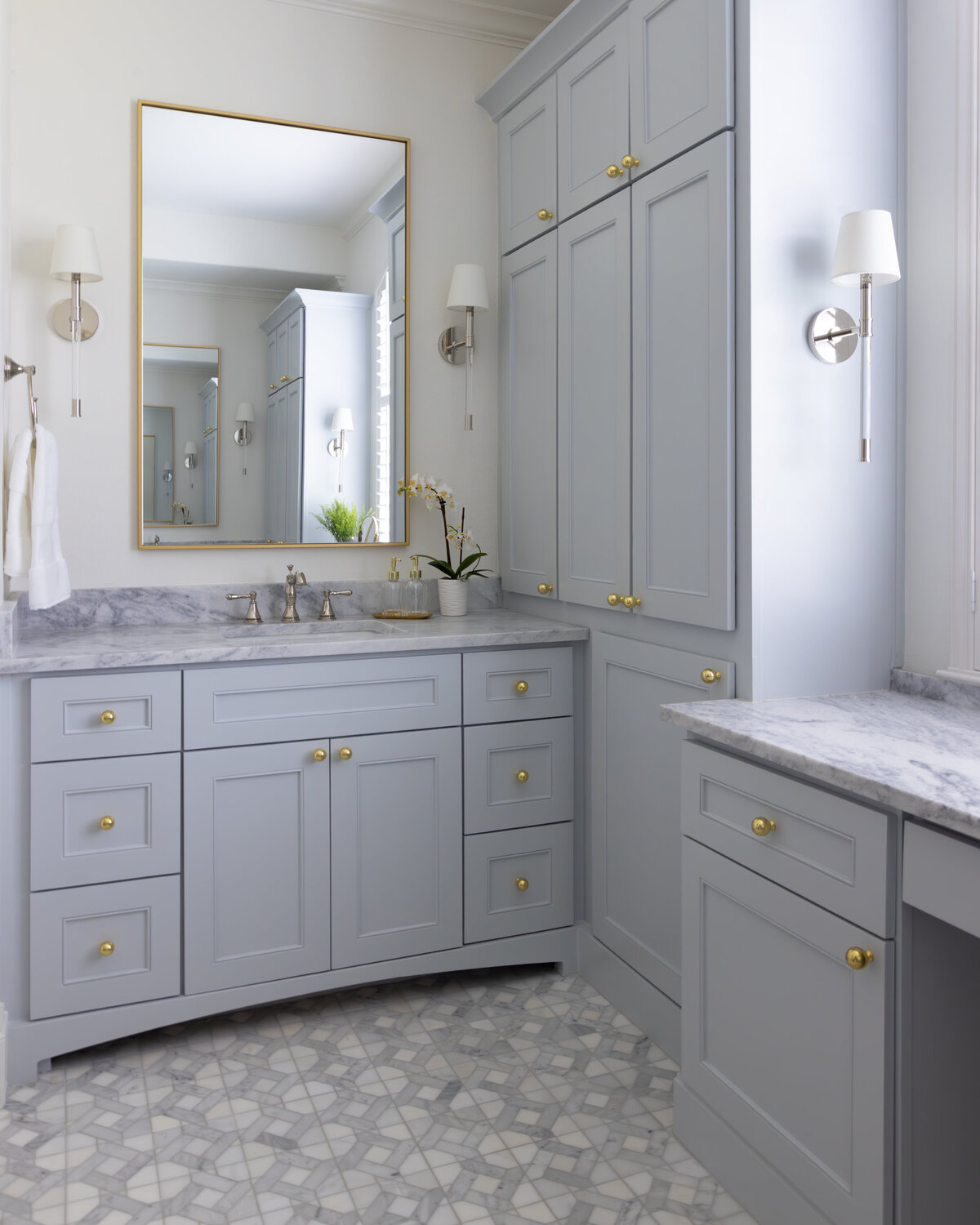 kyleen bushroe interiors pale blue built in cabinets bathroom