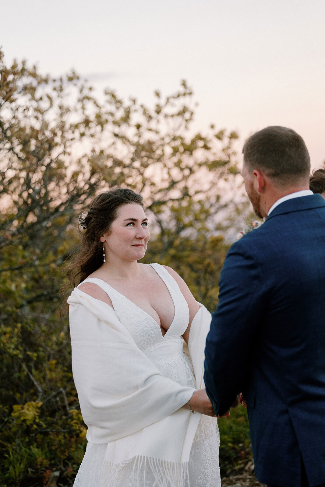 A birde smiles at her groom during their ceremony at Stony Man Summit