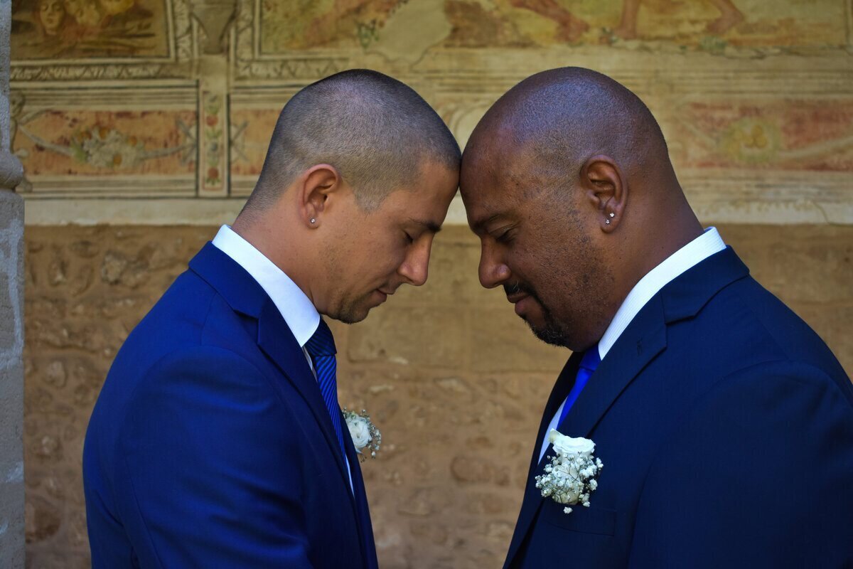 A couple sharing a tender moment during their first look on wedding day