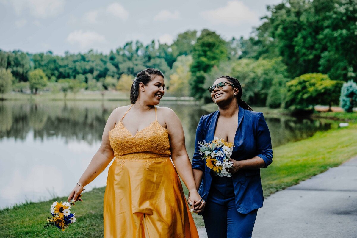 two woman walking together after getting married in north carolina